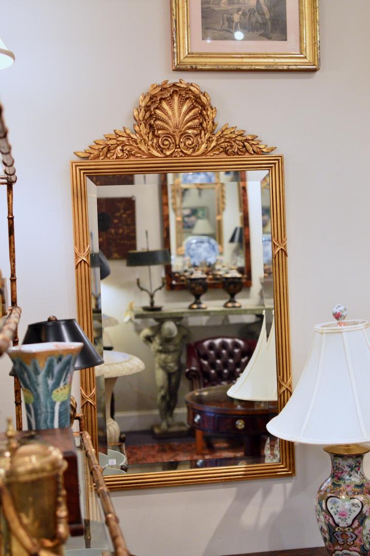 Gold framed mirror w/ leaf pattern