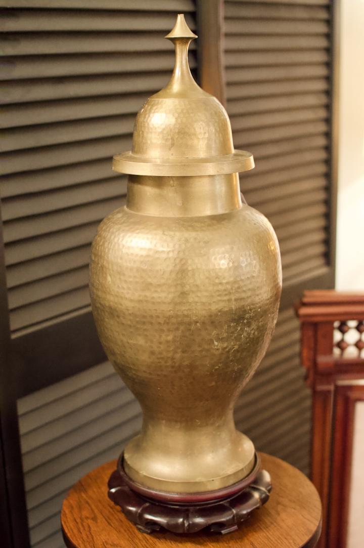 Shop Large vintage hammered brass temple jar on carved wood stand | Hunt & Gather
