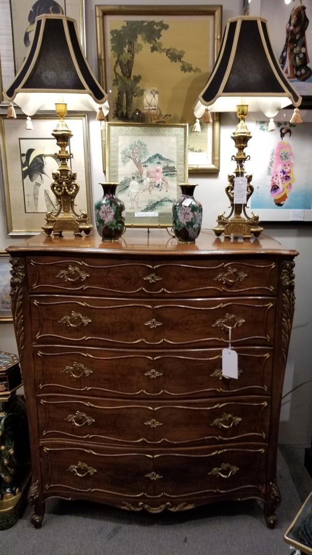 Shop Beautiful lines on this antique French tall chest with bombe sides. Wonderful brass hardware and gold gilt accents on carving. Nice heirloom piece. | Hunt & Gather
