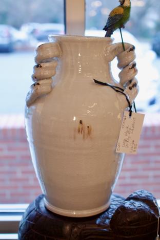 Large white pottery vase w/ parrot