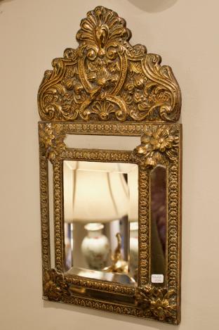 Beveled mirror in brass frame