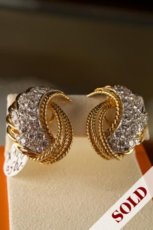 Floral design diamond earrings set in 18K & platinum