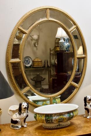 Oval gilt framed mirror.
