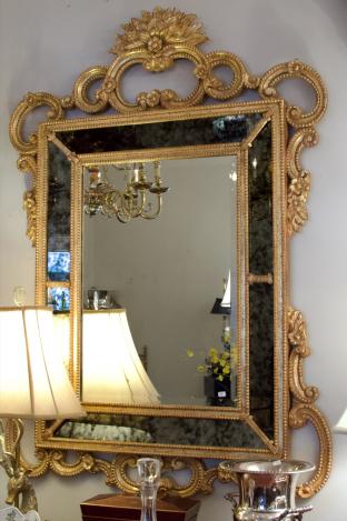 Ornate gilt framed scroll leaf mirror