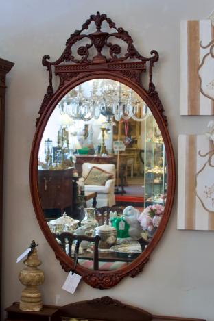 Walnut wood carved oval mirror