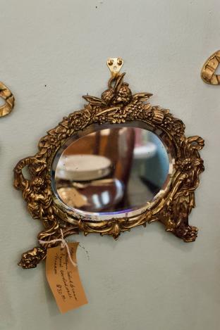 Antique solid brass figural beveled wall mirror