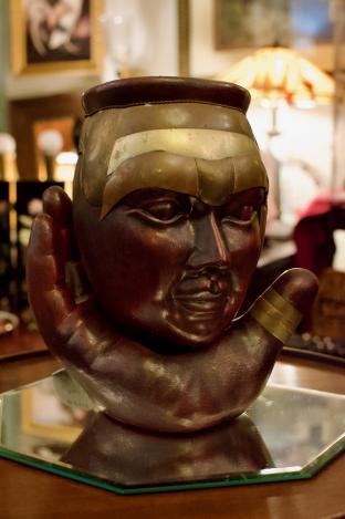 Head on a hand - ceramic & brass
