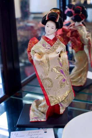 Small Japanese doll on stand