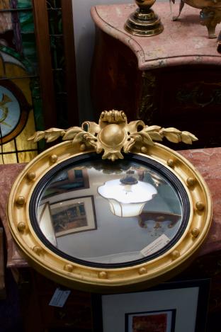 Antique, Empire gilt finished bullseye mirror w/ crest