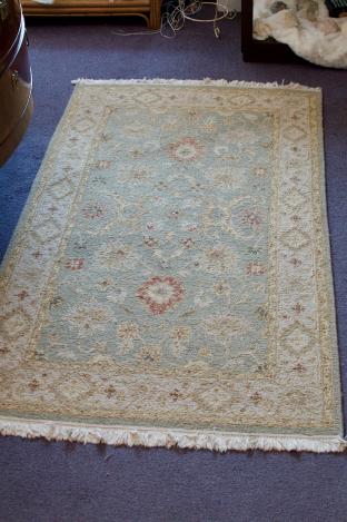 Green & cream rug