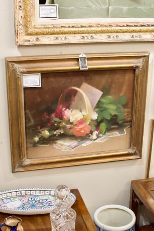 Still life w/ basket of roses & cards on a table