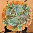 Beautiful mold work & painting Majolica plate. Signed.