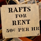 “Rafts for rent” painted sign