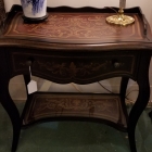 Black decorative table with one drawer. Glass shelf on bottom. Perfect size for many spots in your home.