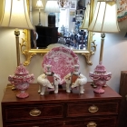 Petite sized chest of drawers. Great original hardware. Fabulous pink serving plate and pink reticulated urns. Asian elephant candlesticks compliment group nicely.