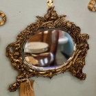 Antique solid brass figural beveled wall mirror