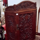 Carved corner cabinet