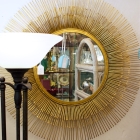 Round gold colored mirror