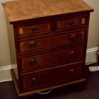 Burled inlaid small chest of drawers