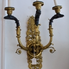 Pair of French empire style ormolu and bronze wall sconces