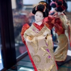 Small Japanese doll on stand