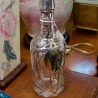 Early sterling overlay liquor bottle
