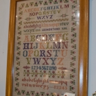 Brightly colored Dutch sampler, framed (Antwerp)