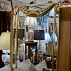 Gold drapery top decorator mirror