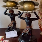 Pair of black servant w/ clam shell on top w/ gold ball