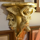 Pair of gilded cherub small shelves