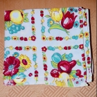 Vintage table cloth with alternating blocks of fruit / flowers